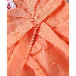 Babyhug Sleeveless Swiss Dot Woven Top With Bow & Frill Detailing - Peach