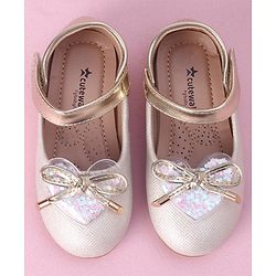 Cute Walk by Babyhug Velcro Closure Shimmer Striped Bellies with Bow Applique - Pink