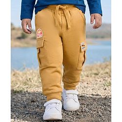Babyhug French Terry Knit Full Length Lounge Pant With Badge Detailing & Cargo Pockets - Cream