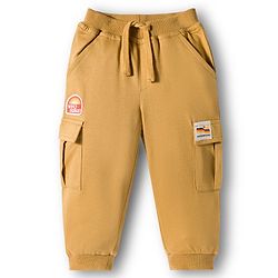Babyhug French Terry Knit Full Length Lounge Pant With Badge Detailing & Cargo Pockets - Cream