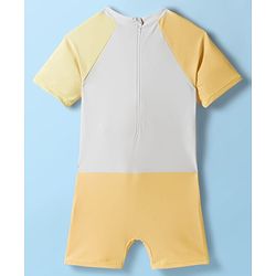 Babyhug Raglan Half Sleeves Giraffe Printed Legged Swimsuit With Cap - Light Yellow & White