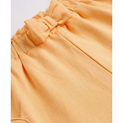 Babyhug Terry Knit Mid Thigh Shorts With Heart Embroidery & Bow Applique - Peach