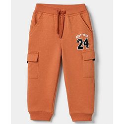 Babyhug Cotton Terry Knit Jogger Fit Full Length Lounge Pants with Best Team 24 Text Print - Rust Orange