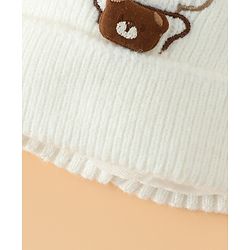 Babyhug Woollen Pom Pom Cap With Bear Design Off White - Diameter 9 cm