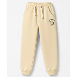 Babyhug 100% Cotton Terry Knit Full Length Lounge Pants With Text Print - Beige